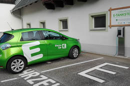 E-car at charging station in the nature park