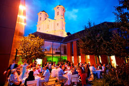 The basilica is illuminated in the evening