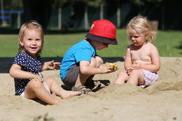 Children at the sand playground in the St. Ruprecht river pool