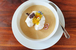 Dandelion dumplings on vanilla pudding