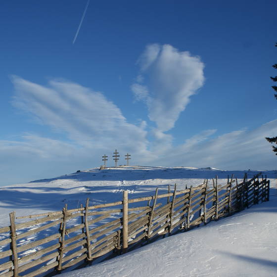 Weather crosses in a snowy landscape