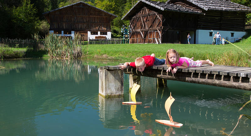 Children playing by the pond