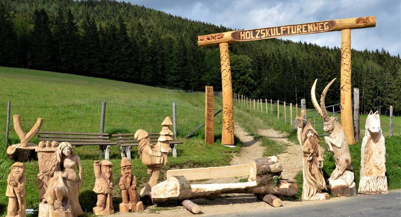 Wooden sculpture path entrance