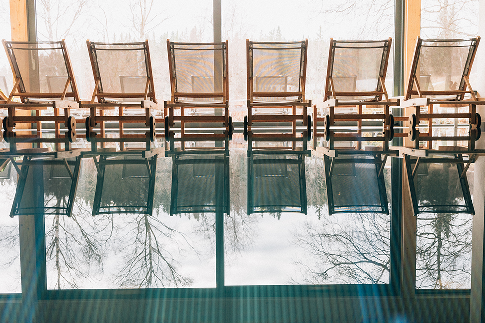 Pool and sun loungers at the Naturhotel Bauernhofer