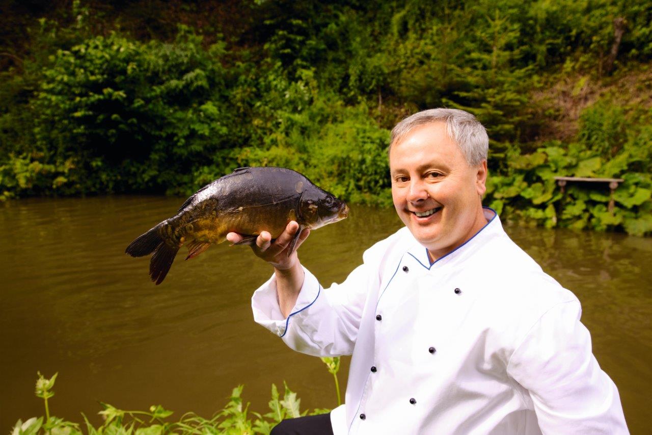 Franz Kulmer with his own fish at the Kulmer fish restaurant