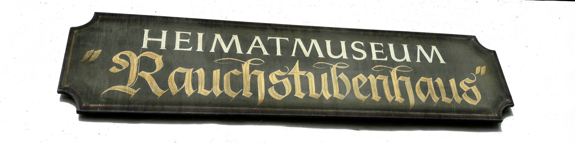 Sign at the entrance to the Rauchstubenhaus Edelschachen